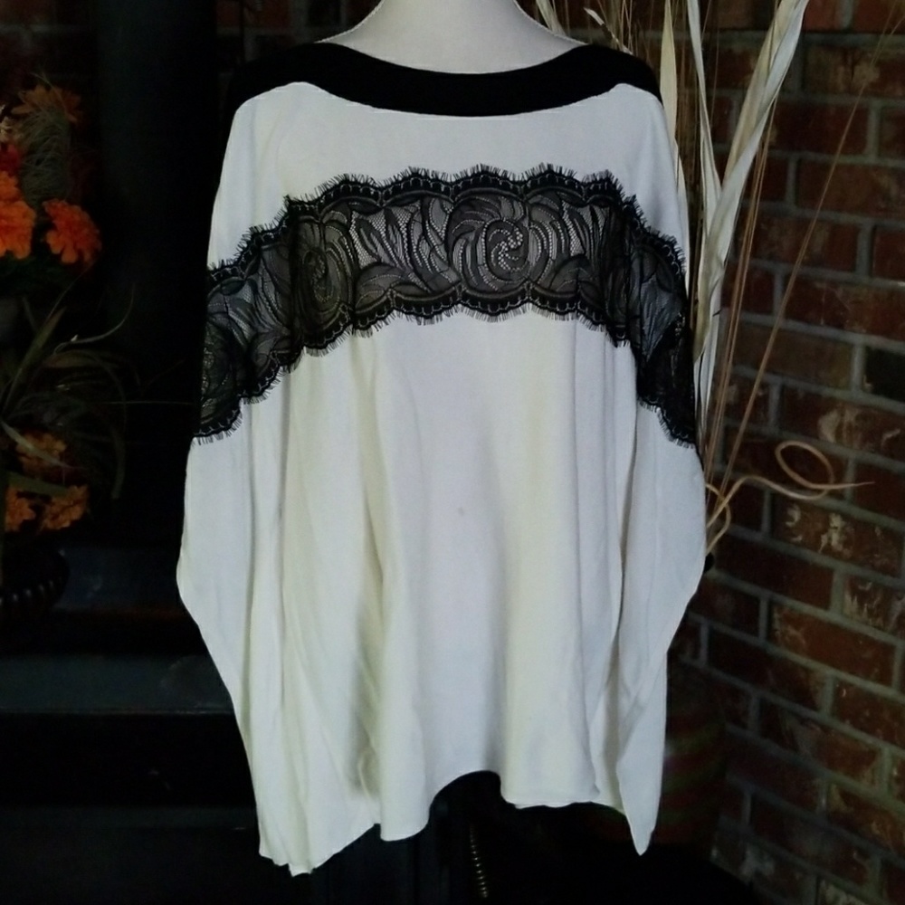 Chicos cream sweater with black lace.